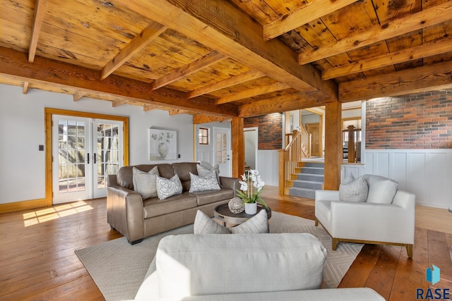 705 E 21st St, Sioux Falls, SD 57105 - living room with wooden ceiling with exposed beams, stairway, wood-type flooring, french doors, and baseboards