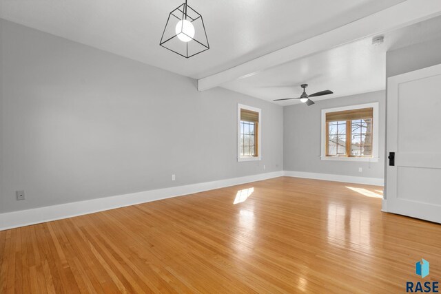 705 E 21st St, Sioux Falls, SD 57105 - empty room featuring baseboards, light wood-type flooring, and ceiling fan