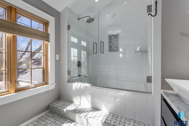 705 E 21st St, Sioux Falls, SD 57105 - full bathroom featuring a tile shower, vanity, and baseboards