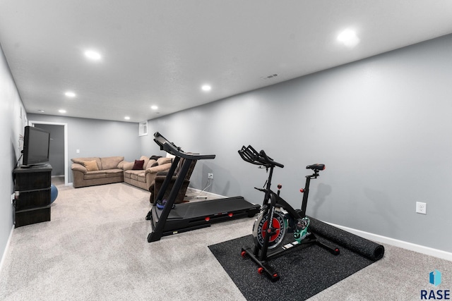 workout area featuring recessed lighting, carpet flooring, and baseboards