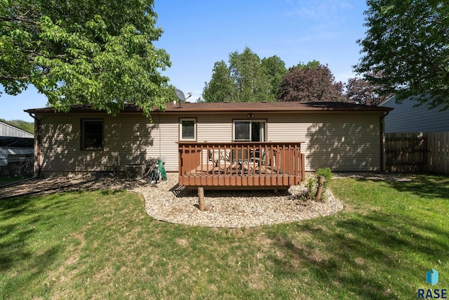 back of property with a wooden deck