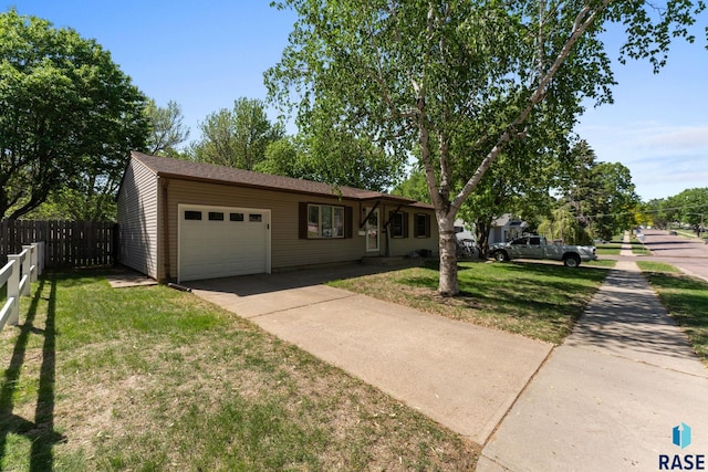 single story home with driveway and a garage