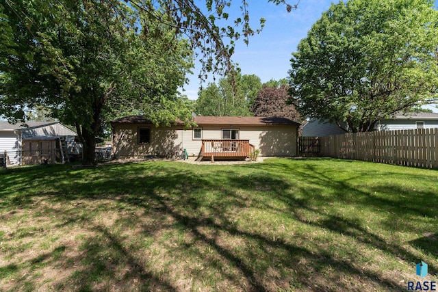 rear view of house with a wooden deck