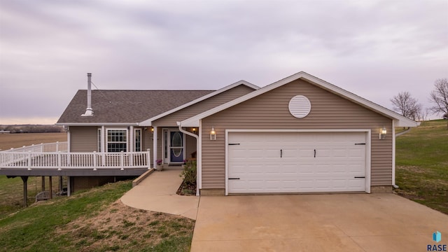 48288 Arrowhead Ct, Canton, SD 57013 - ranch-style home with concrete driveway, a deck, a garage, a front lawn, and a shingled roof