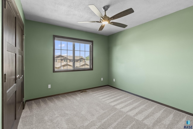 2541 E Meadowside Pl, Sioux Falls, SD 57108 - carpeted empty room with a textured ceiling, baseboards, and ceiling fan