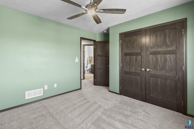 2541 E Meadowside Pl, Sioux Falls, SD 57108 - unfurnished bedroom with carpet, baseboards, a closet, and a ceiling fan