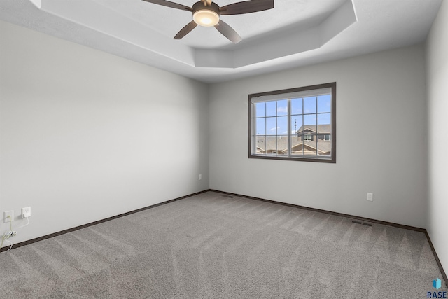 2541 E Meadowside Pl, Sioux Falls, SD 57108 - carpeted spare room with a raised ceiling, a ceiling fan, and baseboards