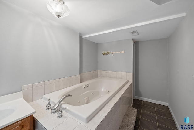 4217 S Cathy Ave, Sioux Falls, SD 57106 - bathroom with a whirlpool tub, tile patterned flooring, vanity, and baseboards