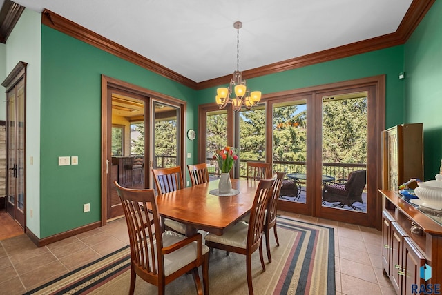 dining space featuring french doors, ornamental molding, light tile patterned floors, a chandelier, and baseboards