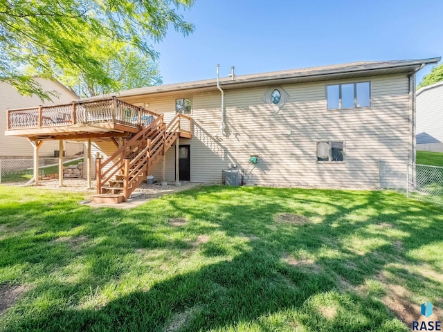 rear view of house featuring a wooden deck, stairs, and central AC