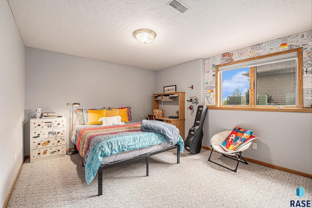 711 Britz Dr, Luverne, MN 56156 - carpeted bedroom with baseboards and a textured ceiling