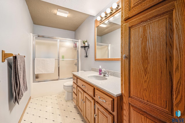 711 Britz Dr, Luverne, MN 56156 - bathroom with toilet, tile patterned floors, vanity, and enclosed tub / shower combo