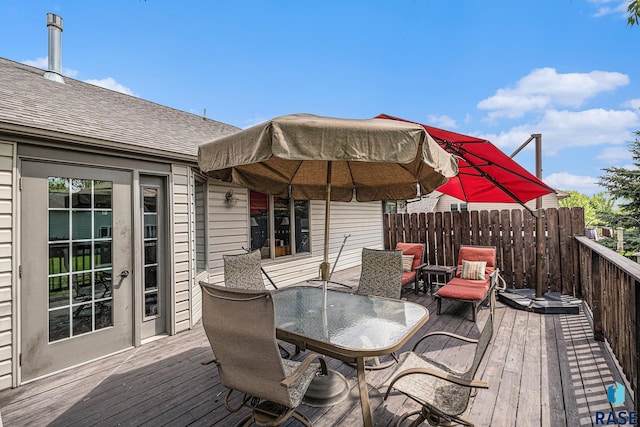 711 Britz Dr, Luverne, MN 56156 - wooden terrace with outdoor dining area