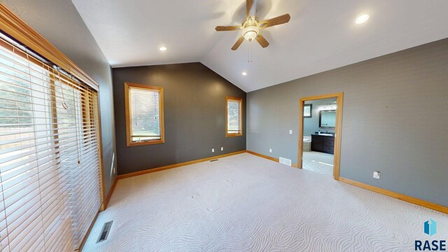 851 Regency Ct, Brookings, SD 57006 - unfurnished bedroom with lofted ceiling, baseboards, light colored carpet, recessed lighting, and connected bathroom