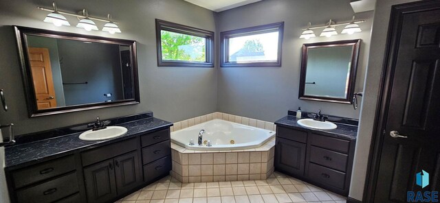 851 Regency Ct, Brookings, SD 57006 - full bath with tile patterned floors, a whirlpool tub, and two vanities