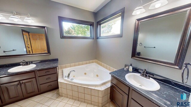 851 Regency Ct, Brookings, SD 57006 - full bath featuring two vanities, tile patterned flooring, and a tub with jets