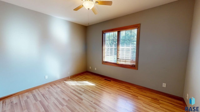 851 Regency Ct, Brookings, SD 57006 - empty room featuring ceiling fan, light wood-type flooring, and baseboards