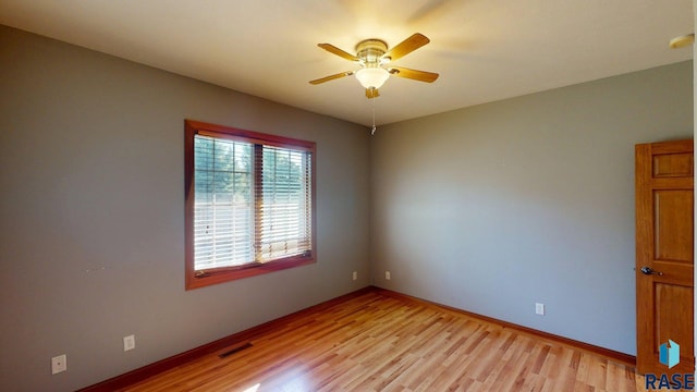 851 Regency Ct, Brookings, SD 57006 - spare room featuring light wood-style floors, ceiling fan, and baseboards