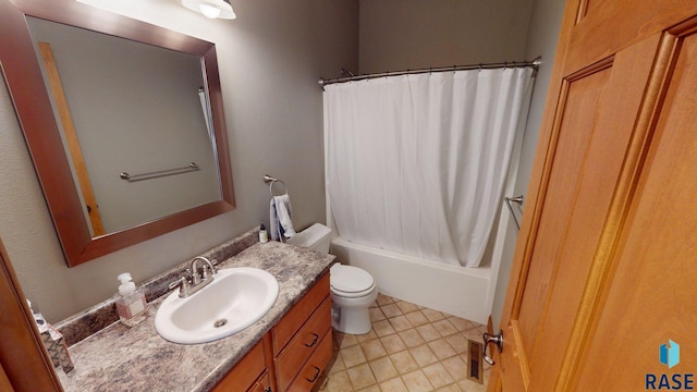 851 Regency Ct, Brookings, SD 57006 - full bath featuring vanity, toilet, shower / tub combo, and tile patterned flooring