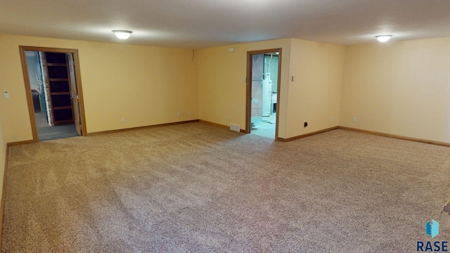 851 Regency Ct, Brookings, SD 57006 - carpeted spare room featuring baseboards