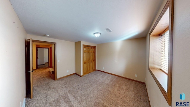 851 Regency Ct, Brookings, SD 57006 - unfurnished bedroom featuring carpet flooring and baseboards