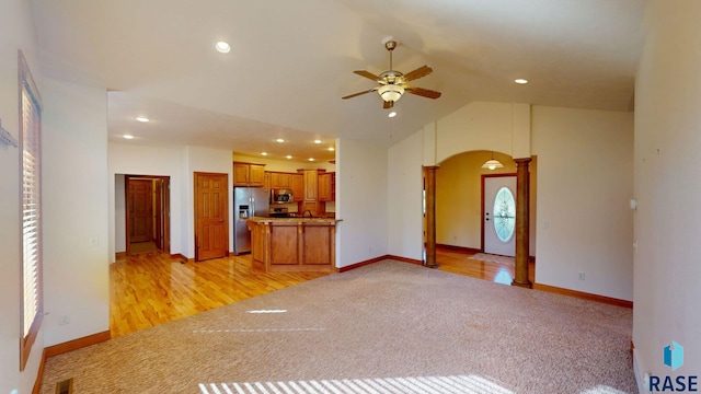 851 Regency Ct, Brookings, SD 57006 - unfurnished living room with ceiling fan, arched walkways, light colored carpet, recessed lighting, and a sink