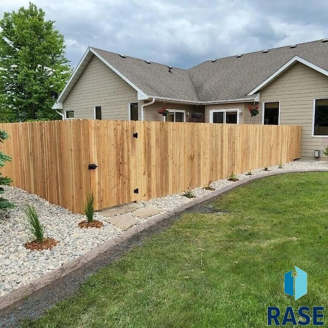 851 Regency Ct, Brookings, SD 57006 - view of home's exterior featuring roof with shingles