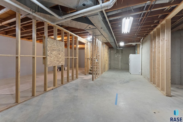 1335 Blue Ox St, Harrisburg, SD 57032 - unfinished basement with freestanding refrigerator