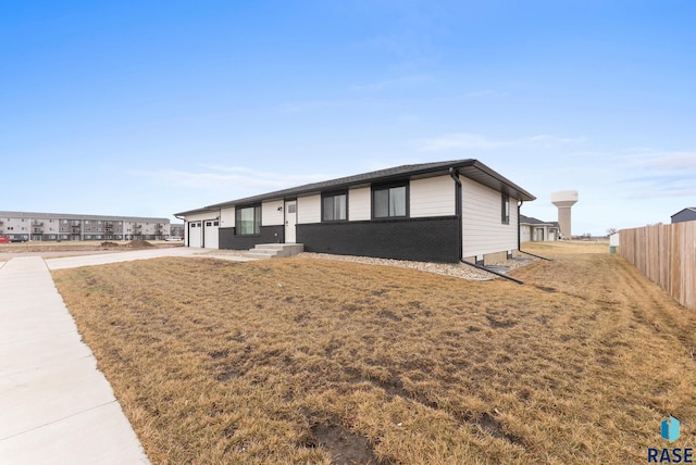 1335 Blue Ox St, Harrisburg, SD 57032 - ranch-style home featuring concrete driveway, a garage, and brick siding