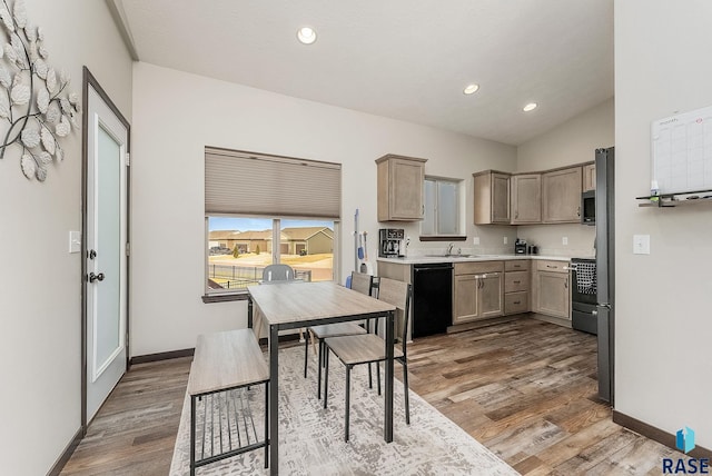 kitchen with dishwasher, stainless steel microwave, wood finished floors, light countertops, and recessed lighting