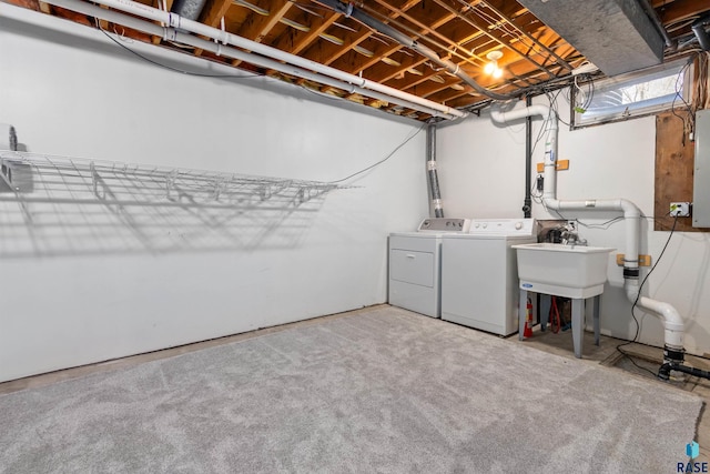 laundry area featuring washing machine and clothes dryer and electric panel