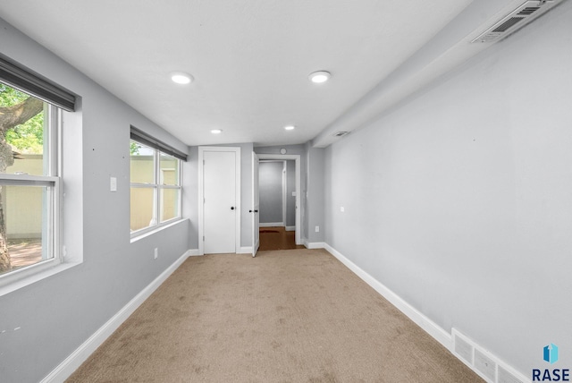 unfurnished bedroom featuring carpet floors, recessed lighting, and baseboards