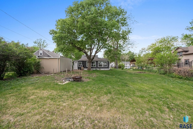 view of yard with a fire pit