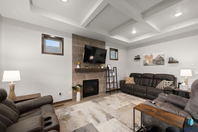 living room featuring wood finished floors, beam ceiling, coffered ceiling, a tile fireplace, and recessed lighting