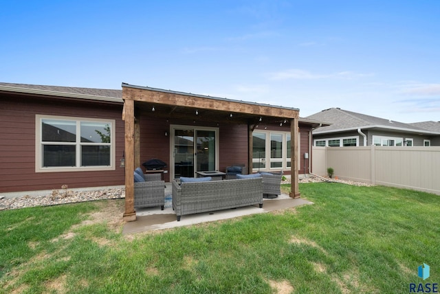 back of property with outdoor lounge area and a patio