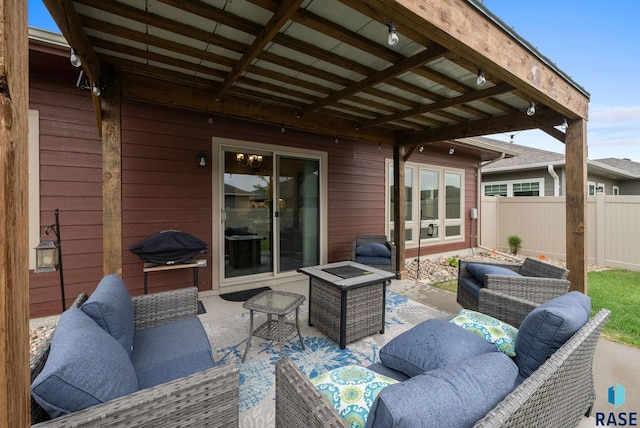 view of patio / terrace with an outdoor living space and fence