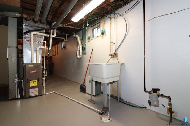 below grade area featuring heating unit