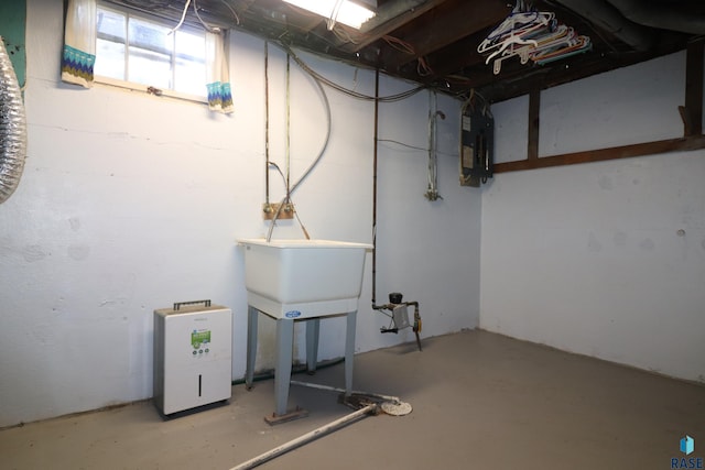 basement featuring electric panel