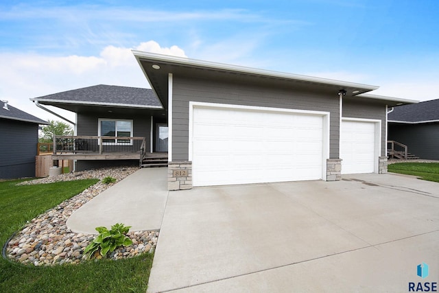 812 Trojan Ave, Hartford, SD 57033 - ranch-style home featuring concrete driveway, an attached garage, a porch, and a shingled roof