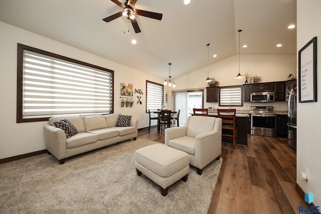 812 Trojan Ave, Hartford, SD 57033 - living room with ceiling fan, recessed lighting, dark wood-type flooring, high vaulted ceiling, and baseboards