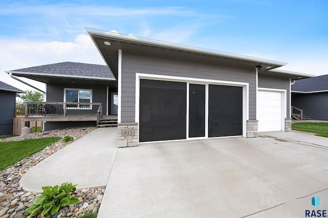 812 Trojan Ave, Hartford, SD 57033 - ranch-style house featuring stone siding and covered porch
