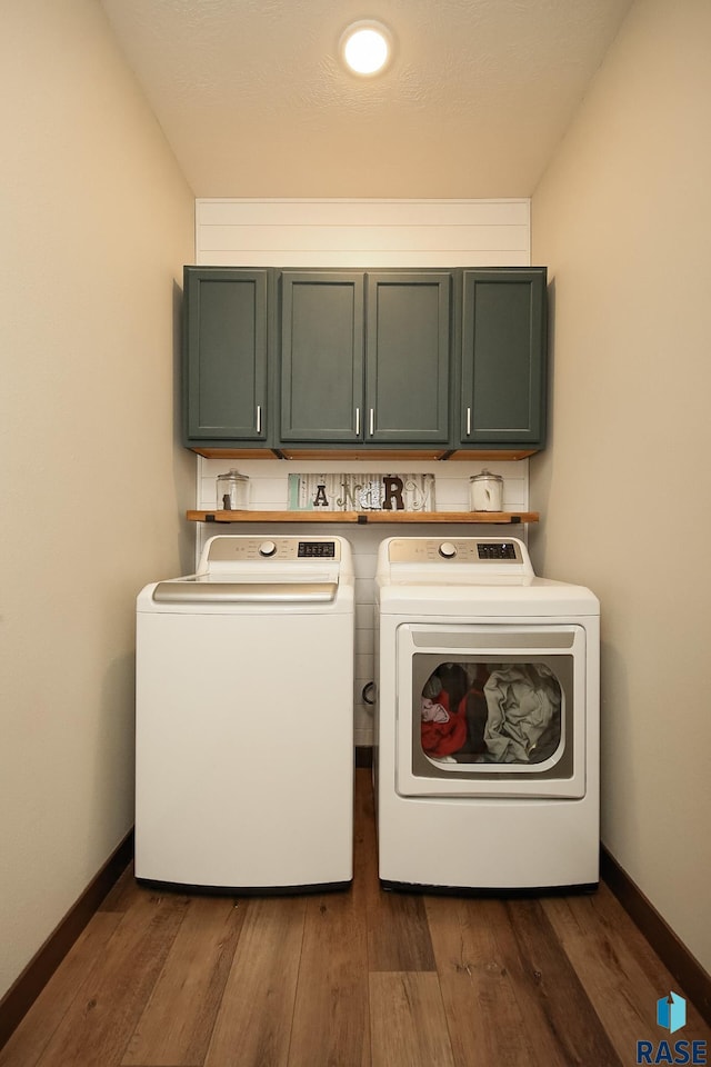 812 Trojan Ave, Hartford, SD 57033 - laundry area featuring cabinet space, separate washer and dryer, dark wood finished floors, and baseboards
