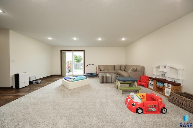 812 Trojan Ave, Hartford, SD 57033 - living room with recessed lighting, wood finished floors, and baseboards