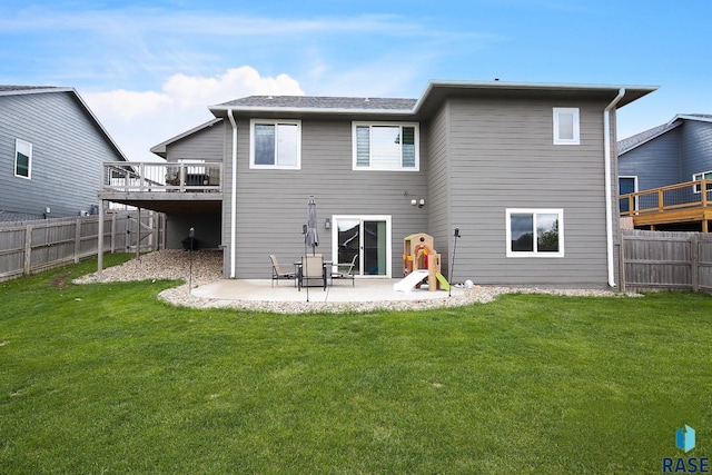 812 Trojan Ave, Hartford, SD 57033 - back of house with a wooden deck and a patio