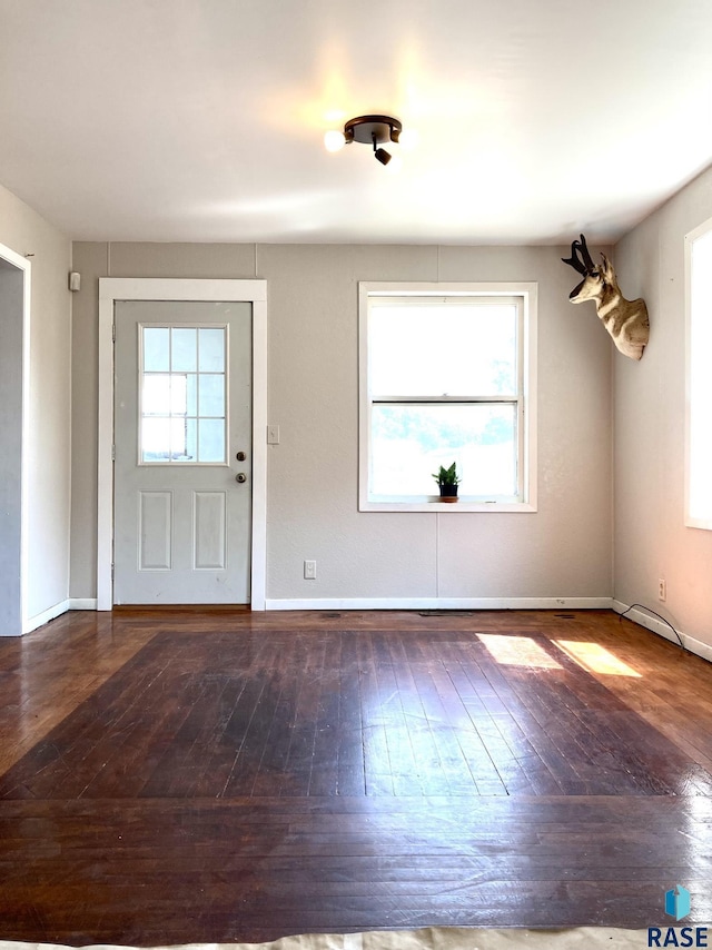 305 S 5th St, Menno, SD 57045 - foyer entrance with hardwood / wood-style floors and baseboards