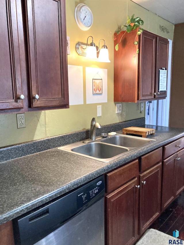 305 S 5th St, Menno, SD 57045 - kitchen with dishwasher, a sink, dark countertops, and dark wood-style flooring