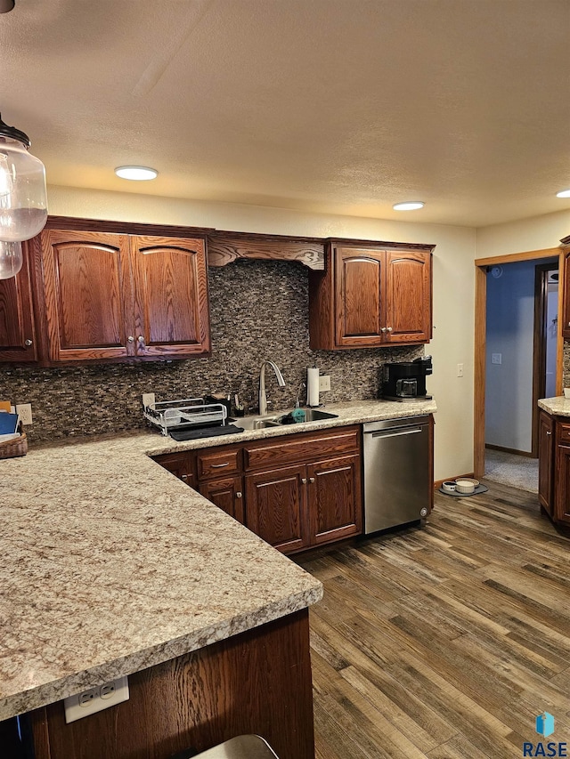 1005 8th Ave, Pipestone, MN 56164 - kitchen with stainless steel dishwasher, a sink, light countertops, decorative backsplash, and recessed lighting