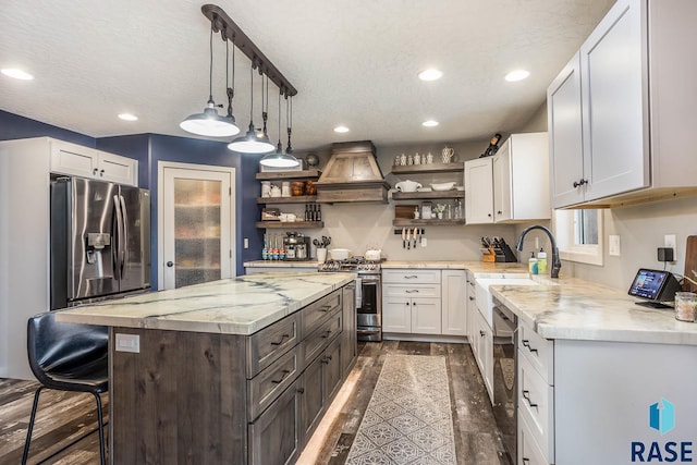 25265 466th Ave, Hartford, SD 57033 - kitchen with open shelves, stainless steel appliances, custom range hood, a sink, and recessed lighting
