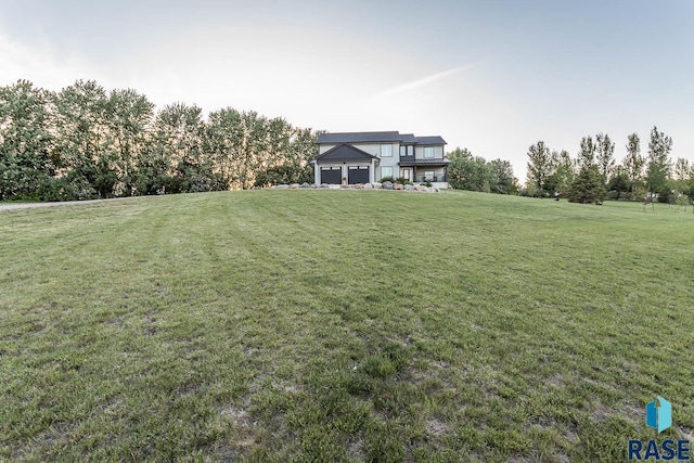 25265 466th Ave, Hartford, SD 57033 - view of green lawn featuring a garage