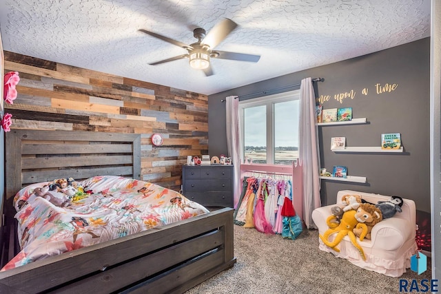 25265 466th Ave, Hartford, SD 57033 - carpeted bedroom with wood walls, a textured ceiling, and a ceiling fan